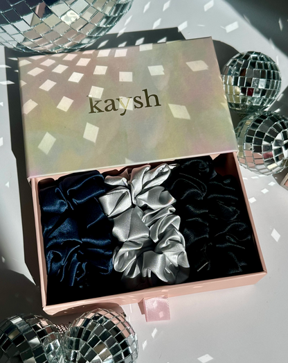 100% mulberry silk scrunchies inside a gift box. Shiny, luxurious and soft to touch. 
