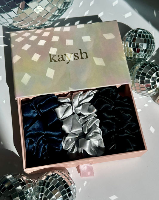 100% mulberry silk scrunchies inside a gift box. Shiny, luxurious and soft to touch. 
