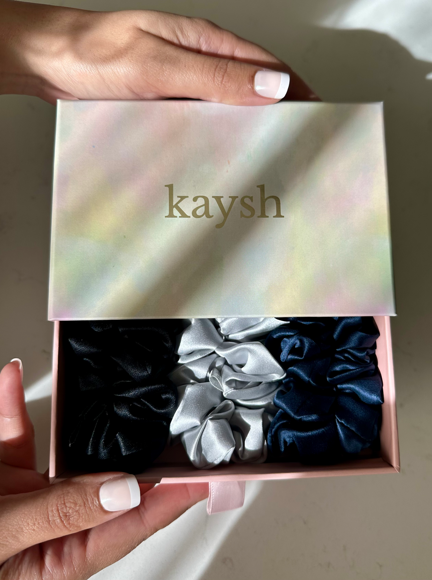 100% mulberry silk scrunchies inside a gift box. Shiny, luxurious and soft to touch. 