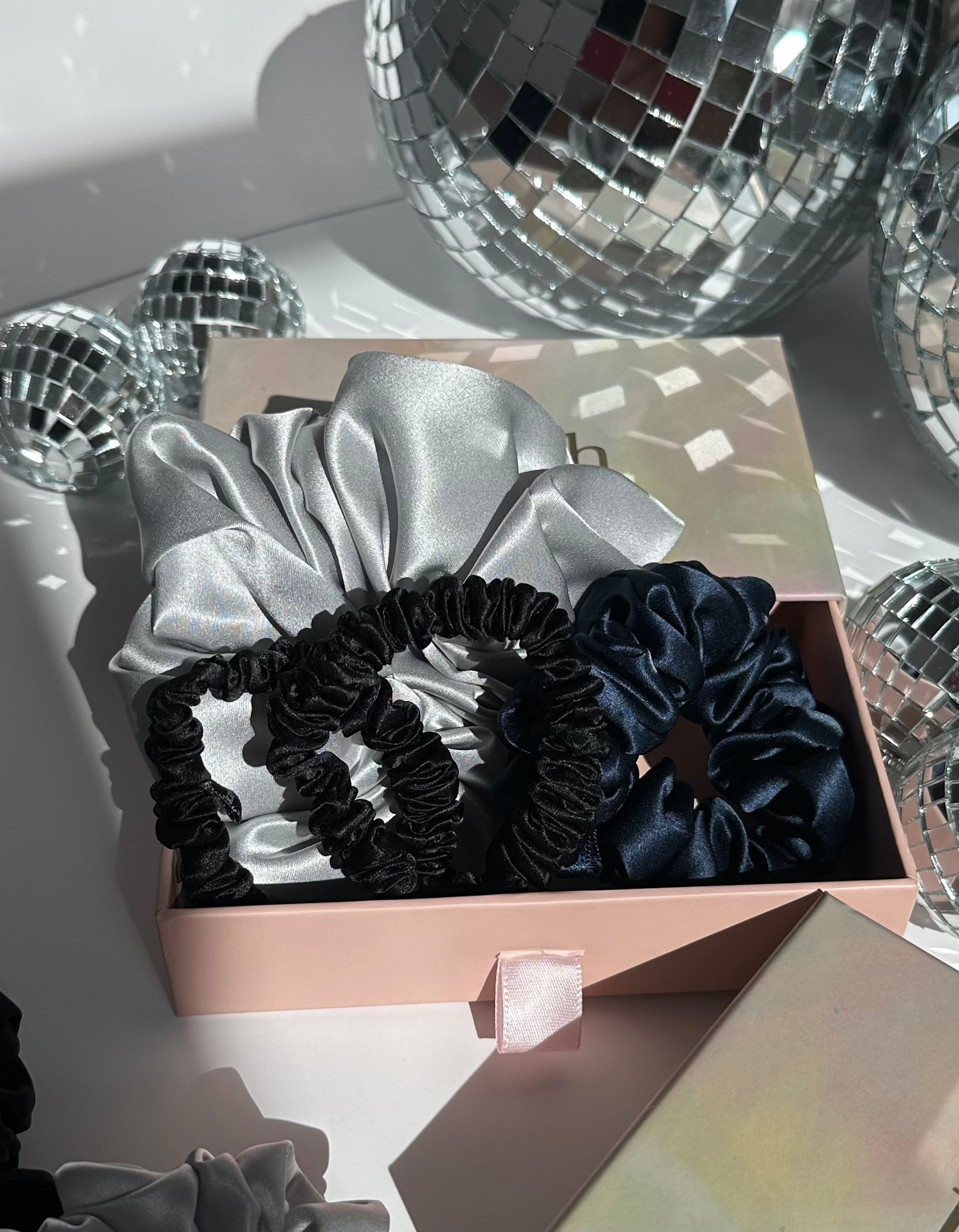 100% mulberry silk scrunchies inside a gift box. Shiny, luxurious and soft to touch. 