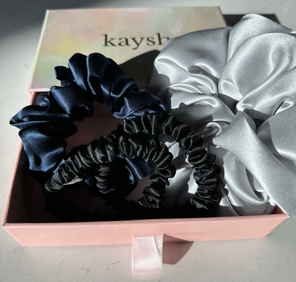 100% mulberry silk scrunchies inside a gift box. Shiny, luxurious and soft to touch. 