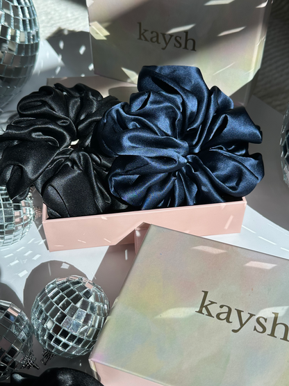 100% mulberry silk scrunchies inside a gift box. Shiny, luxurious and soft to touch. 