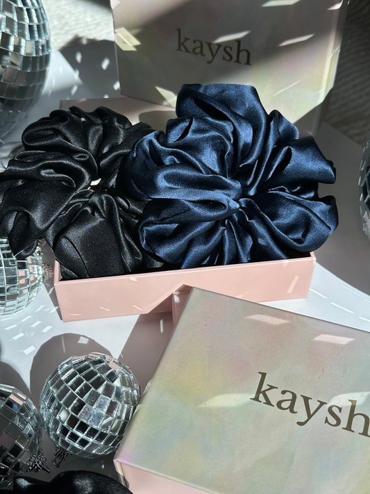 100% mulberry silk scrunchies inside a gift box. Shiny, luxurious and soft to touch. 