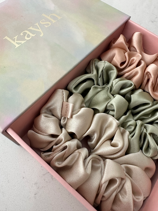 100% mulberry silk scrunchies inside a gift box. Shiny, luxurious and soft to touch. 