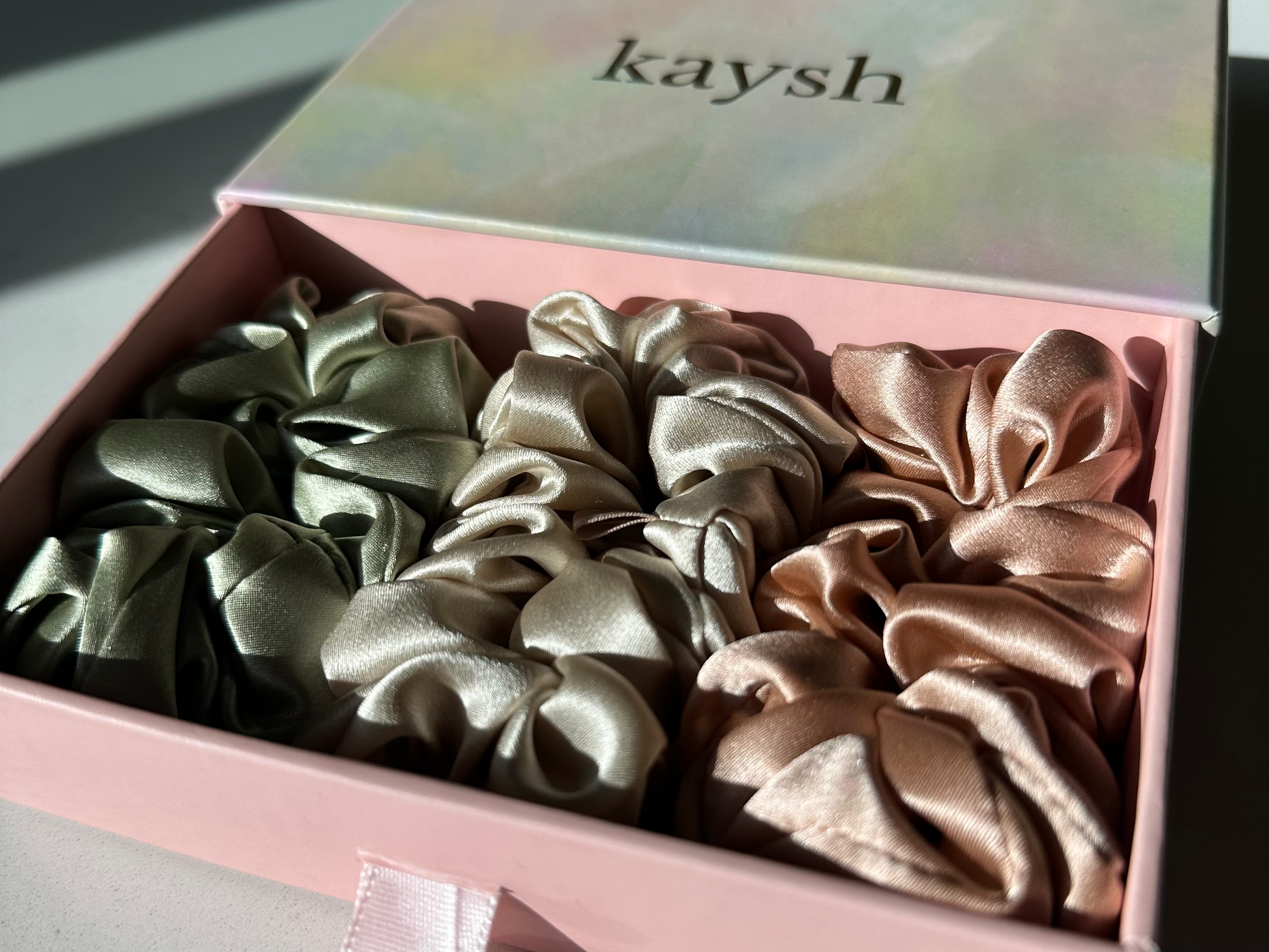 100% mulberry silk scrunchies inside a gift box. Shiny, luxurious and soft to touch. 