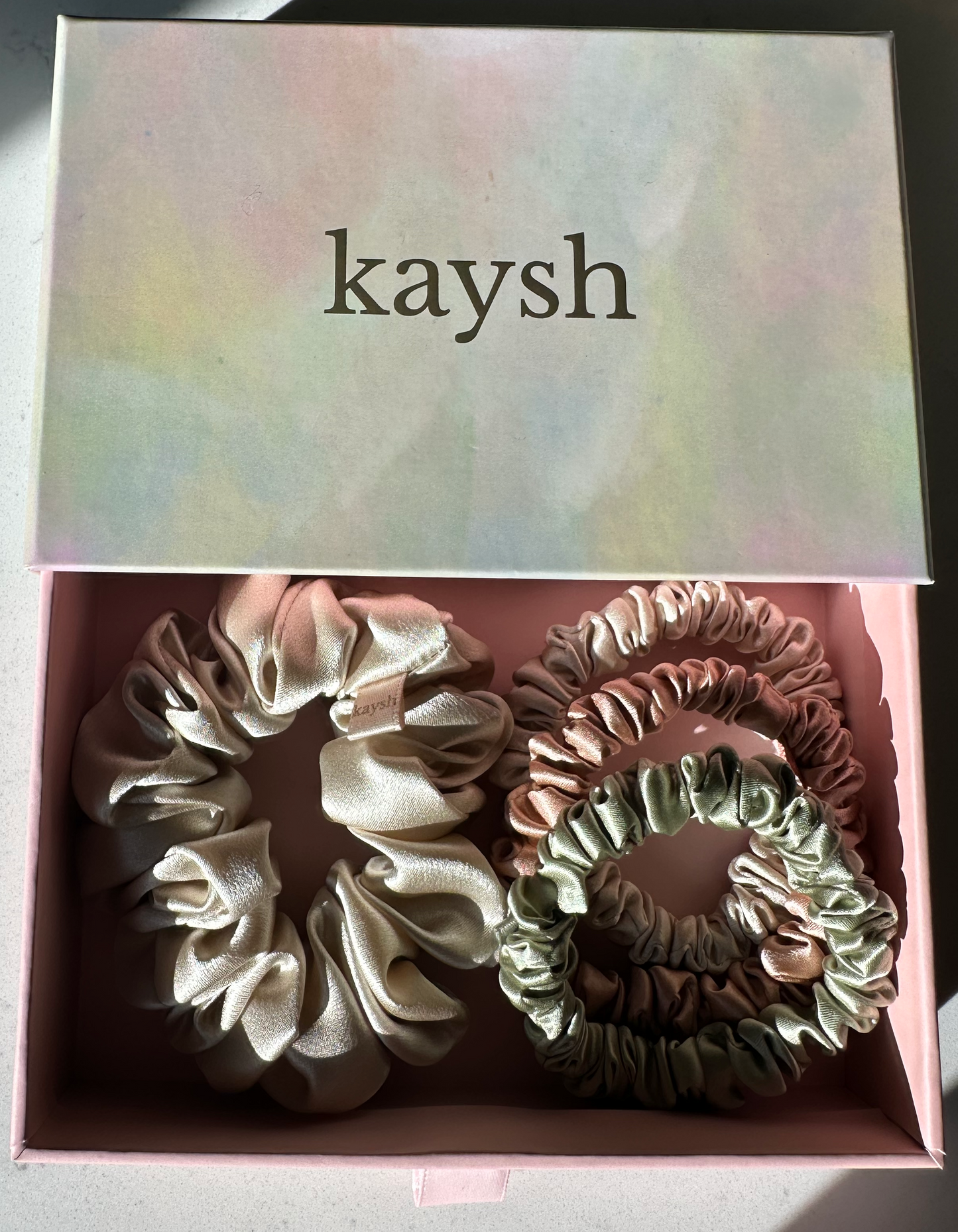 100% mulberry silk scrunchies inside a gift box. Shiny, luxurious and soft to touch. 
